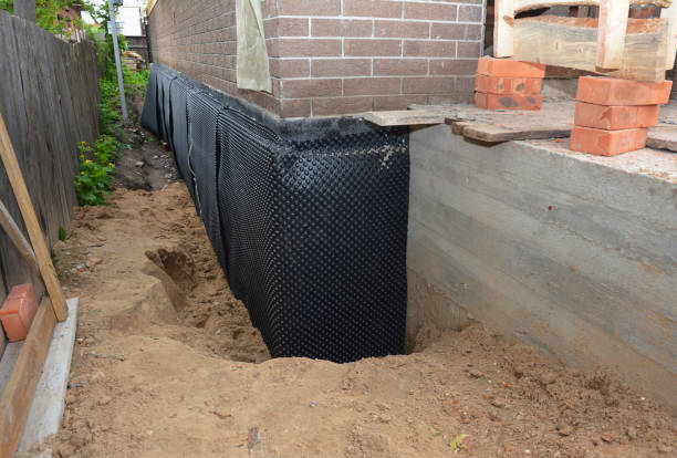 Happy homeowners after waterproofing job in Geneseo